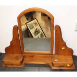 A modern pine dressing table mirror with arched top fitted two drawers,