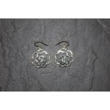 A pair of 925 silver flower head pattern pendant earrings set to centres with pair shaped pale blue