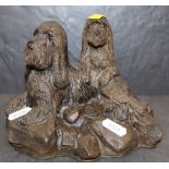 A Patsi Ann resin figure of two dogs, 13 cm high, No.