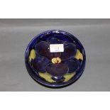 A Moorcroft pottery Pansy pattern shallow bowl, 14.5 cm diameter x 5 cm high.