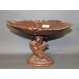 A 19th century "Black Forest", carved and stained pine oval bowl of naturalistic design,