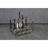 A George V silver four division toast rack, 7 x 5 x 8.
