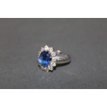 A 19ct white gold Kyanite and diamond flower head ring,