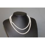 Two fresh water pearl necklaces,