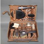 A late 19th/early 20th century ladies travelling vanity case, carved bound,