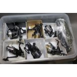 A box lot containing six bait runner reels and twelve reel storage cases,