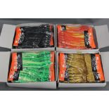 four boxes of Octopus bait sea fishing jigs.