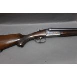 A Spanish 12 bore side by side shotgun with 30" barrels, improved and three quarter choke,