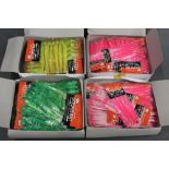 Four boxes of Octopus bait sea fishing jigs.