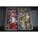 Two large plastic boxes filled with fly tying equipment, chenille, feathers etc.