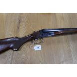 A Russian 12 bore side by side shotgun, with 28 1/2" barrels, three quarter and half choke, boxlock,