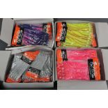 Four boxes of Octopus bait sea fishing jigs.