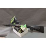 A Remington 700 short synthetic stock, together with a box of Garlands neoprene silencer cover,