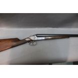 A Baikal 12 bore side by side shotgun with 27 1/2" barrels, full and three quarter choke,