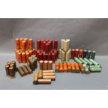 A collection of paper cased 12 bore cartridges,