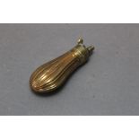 A brass and copper pistol powder flask, with fluted body, length 9 cm.
