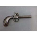 A double barrelled percussion pocket pistol, with 3 1/2 " barrels, double hammer, double trigger,