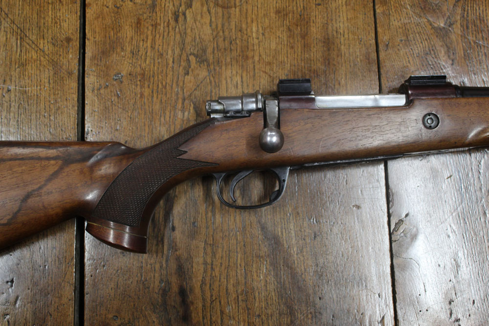 Parker Hale cal 243 bolt action rifle, fitted with a sound moderator and with floor plate magazine.