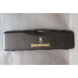 A Browning hard plastic case, suitable for an over/under shotgun with 33" barrels.