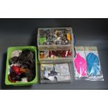 Four plastic boxes filled with fly tying materials, to include Metz, Capes, various yarns, fly line,