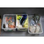 Three plastic boxes filled with fly tying materials, to include peacock feathers,