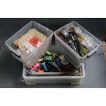 Three large plastic boxes filled with fly tying feathers, threads etc.