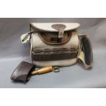 A Musto canvas and leather cartridge bag,