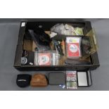 A box of various fly reel pouches, Sierra Neoprene, Worcestershire fly leather pouch,