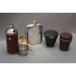 A hip flask together with two cup sets and a cup and flask set.