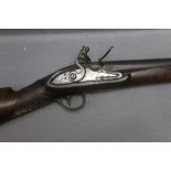A flintlock sporting gun, with 36 1/2" barrel, the lock with sparse naive engraving,