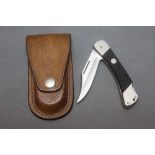 Puma Germany 265 folding pocket knife, with 3" blade in a Whitby knives leather holster.