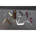 A collection of nine folding pocket knives, blade lengths 1 1/4" - 3 1/2".