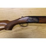 A Lanber 12 bore over/under shotgun, with 28" multi choke barrels, 76 mm chambers, ejector,