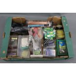 A box containing a Stone Fly marrow spoon/priest, Neoprene reel cases, hooks, swivels etc.