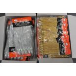 Two boxes of Octopus bait sea fishing jigs.