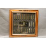 John Ribgy & Co a cartridge display board, with ammunition ranging from 243 - 577 Nitro Express,