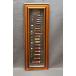 A cartridge display board labelled English Shotgun Sizes from 6 mm - 4 bore, from makers Eley,