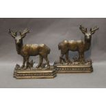 A pair of Stag brass door stops with lead weighted bottoms,