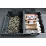 Two large plastic boxes of fly tying Eagle claw hooks and sea fishing hooks.