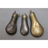 Three pistol powder flasks, steel and copper bodied,