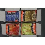 Four boxes of Octopus bait sea fishing jigs.