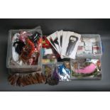 Four plastic boxes filled with McHardys of Carlisle fly tying hooks, grade one turkey tails,