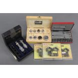 A set of Lyman 243 reloading dies, together with a wad punch set,