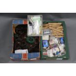 Two boxes of fly lines, cork fishing rod handles, various hooks, Partridge of Redditch,