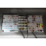 Five trays containing trout flies, lures, nymphs etc.