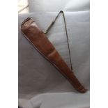 A leather and sheepskin lined shotgun slip, 124 cm.