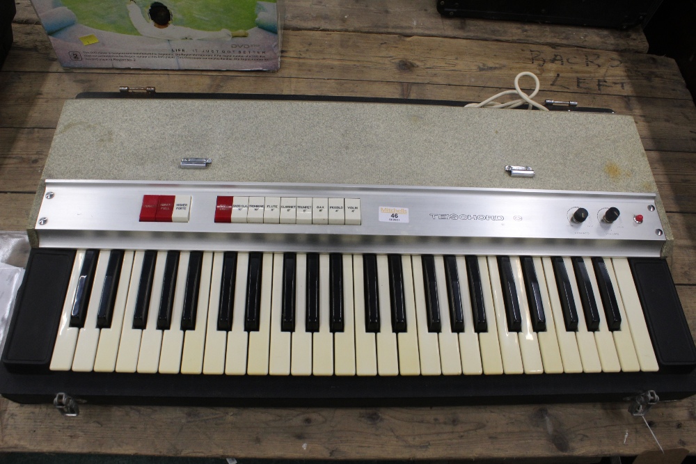 WITHDRAWN- A vintage WEM Teischord C keyboard, contained in fitted case,