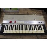 WITHDRAWN- A vintage WEM Teischord C keyboard, contained in fitted case,