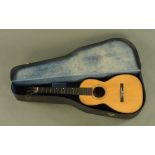 An early 20th century CF Martin & Co of New York acoustic guitar with wide neck,