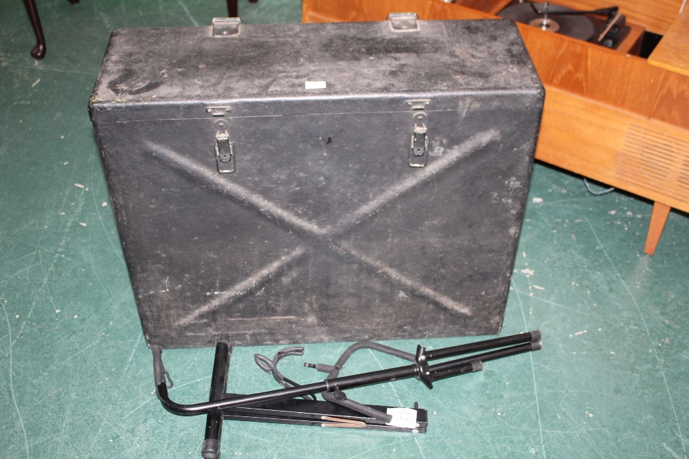 A military black and green painted metal flight case, 82 x 28 x 68 cm high.